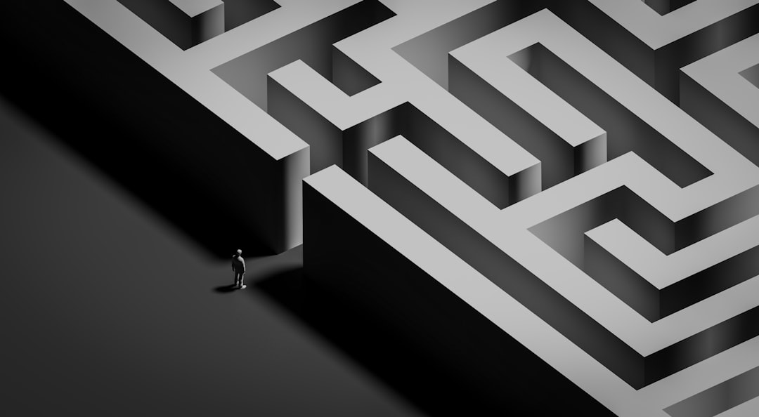 Small figure stands at the entrance of a large maze